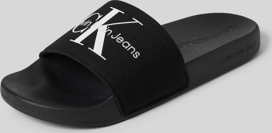 Czarne klapki Calvin Klein z płaską podeszwą