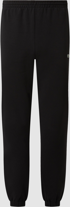 Czarne spodnie Lacoste w sportowym stylu z dresówki