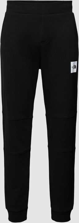Czarne spodnie The North Face z dresówki w sportowym stylu z nadrukiem