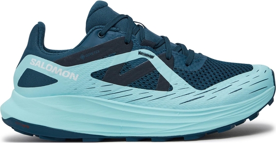 Niebieskie buty sportowe Salomon sznurowane w sportowym stylu