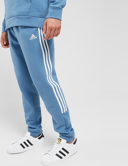 Niebieskie spodnie Adidas Sportswear w sportowym stylu z dresówki