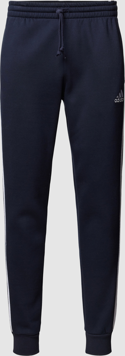 Niebieskie spodnie Adidas Sportswear z dresówki