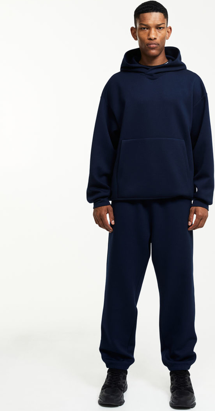 Niebieskie spodnie H & M w sportowym stylu