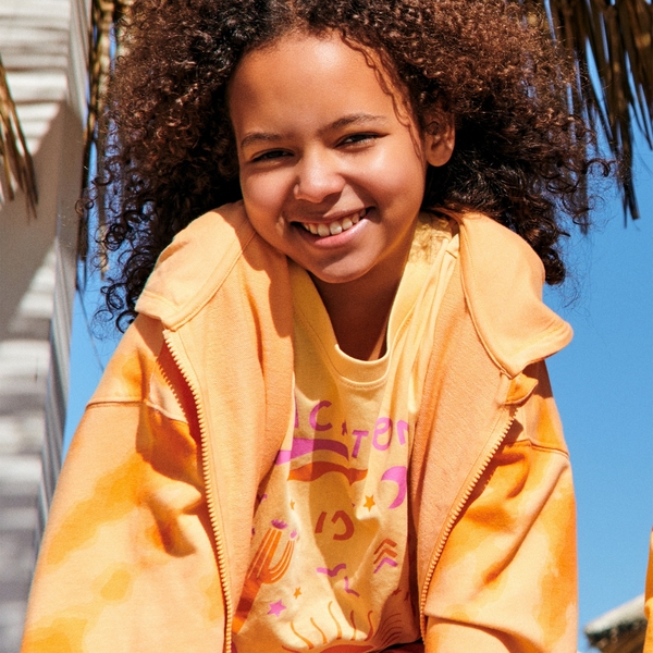 Pomarańczowa bluzka dziecięca Sinsay z bawełny