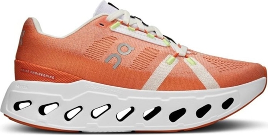 Pomarańczowe buty sportowe On Running sznurowane w sportowym stylu