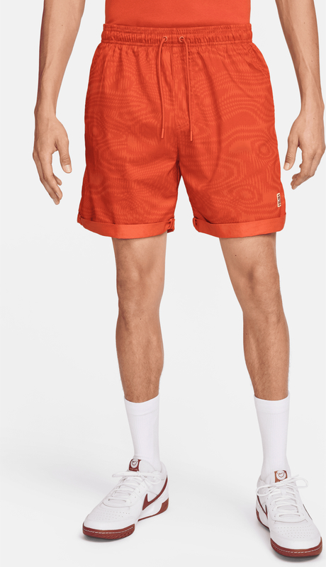 Pomarańczowe spodenki Nike w sportowym stylu z tkaniny