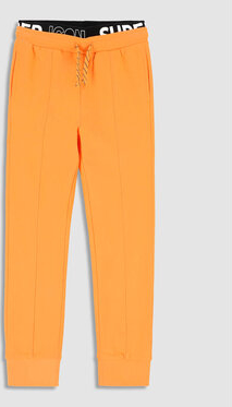 Pomarańczowe spodnie dziecięce MODIVO dla chłopców