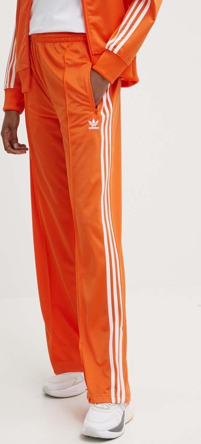 Pomarańczowe spodnie sportowe Adidas Originals z dresówki