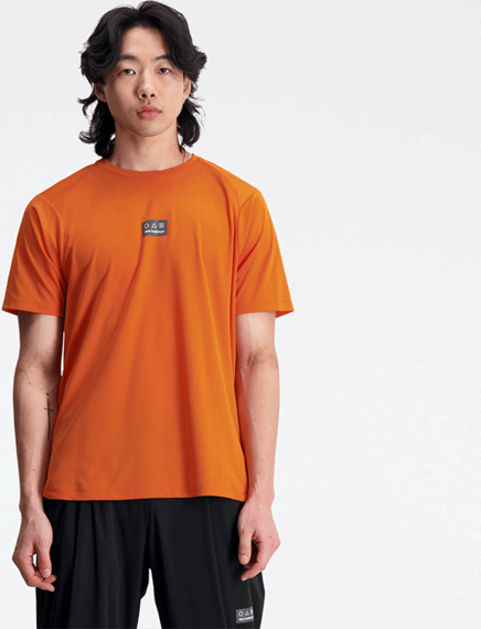 Pomarańczowy t-shirt New Balance z jedwabiu z krótkim rękawem w sportowym stylu