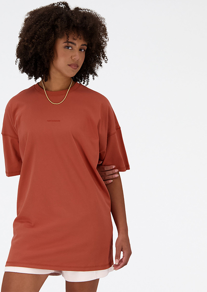 Pomarańczowy t-shirt New Balance z okrągłym dekoltem z krótkim rękawem