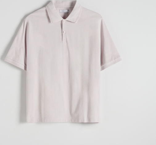 Różowa koszulka polo Reserved z bawełny w stylu casual z krótkim rękawem