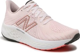 Różowe buty sportowe New Balance sznurowane w sportowym stylu z płaską podeszwą