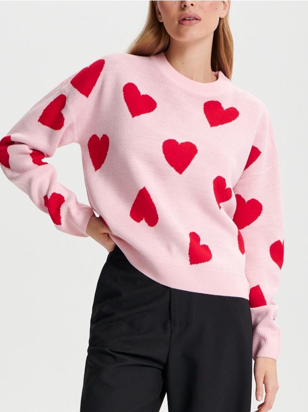 Różowy sweter Sinsay z nadrukiem w stylu casual