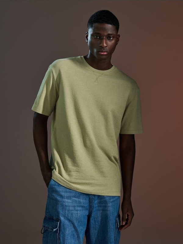 Zielony t-shirt Sinsay z bawełny w stylu casual z krótkim rękawem