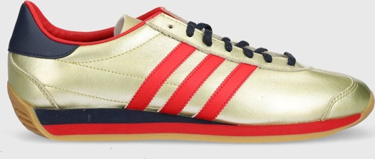 Złote buty sportowe Adidas Originals w sportowym stylu sznurowane