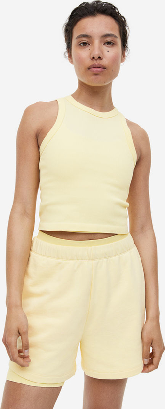 Żółta bluzka H & M z okrągłym dekoltem w sportowym stylu