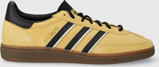 Żółte buty sportowe Adidas Originals sznurowane w sportowym stylu