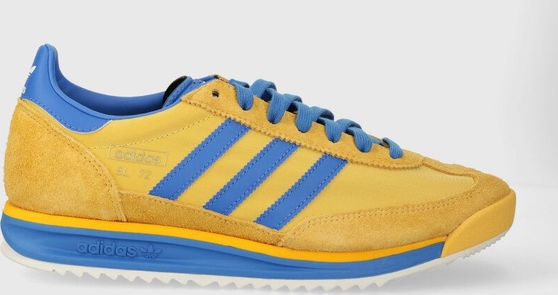 Żółte buty sportowe Adidas Originals w sportowym stylu