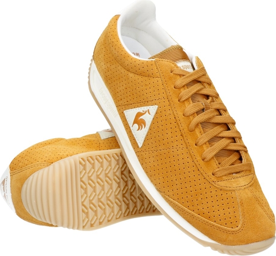 Żółte buty sportowe le coq sportif w sportowym stylu