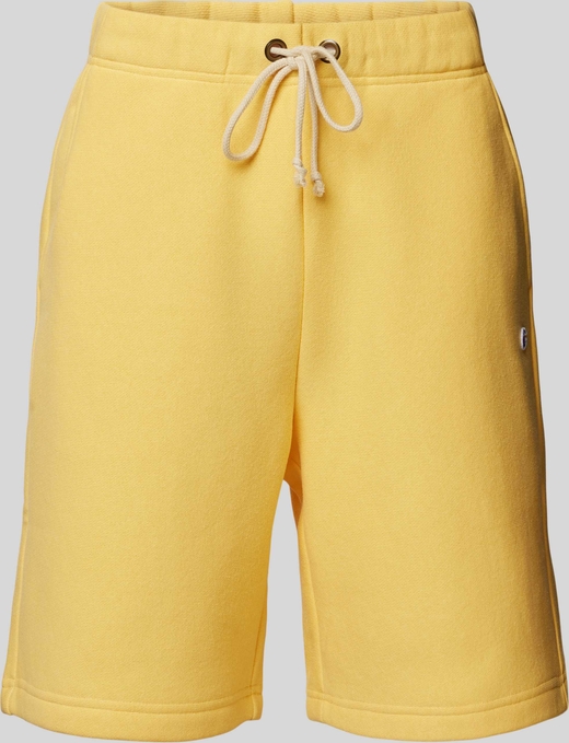 Żółte spodnie Champion z dresówki w sportowym stylu