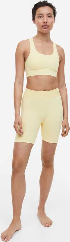 Żółte szorty H & M w sportowym stylu