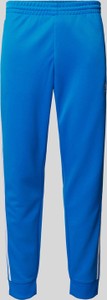 Niebieskie spodnie Adidas Originals w sportowym stylu z dresówki