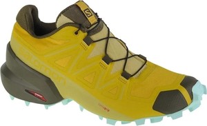 Żółte buty sportowe Salomon sznurowane w sportowym stylu
