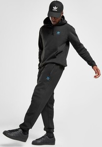 Czarne spodnie Adidas w sportowym stylu z dresówki