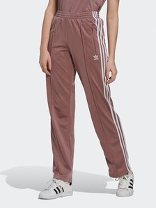 Różowe spodnie sportowe Adidas w sportowym stylu