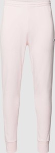 Różowe spodnie Lacoste w stylu casual z dresówki