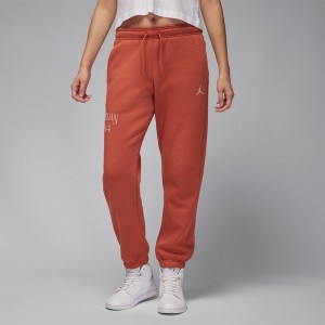 Pomarańczowe spodnie Jordan w sportowym stylu z dresówki