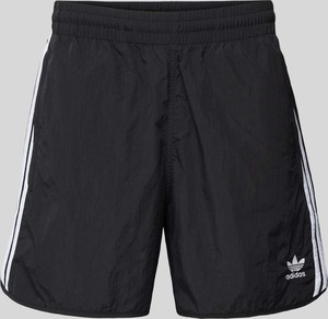 Czarne spodnie Adidas Originals w sportowym stylu