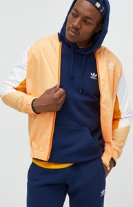 Pomarańczowa kurtka Adidas Originals krótka w sportowym stylu
