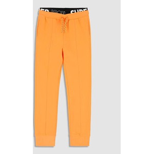 Pomarańczowe spodnie dziecięce MODIVO dla chłopców