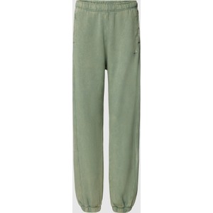 Zielone spodnie Adidas Sportswear z bawełny