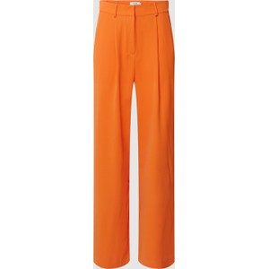 Pomarańczowe spodnie Minus w stylu retro