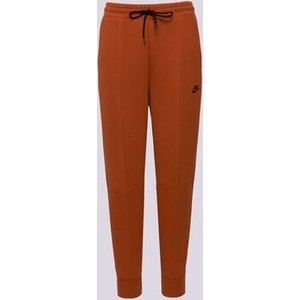 Pomarańczowe spodnie Nike w sportowym stylu