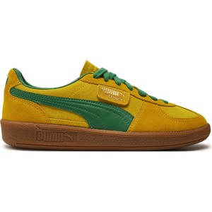Żółte buty sportowe Puma w sportowym stylu