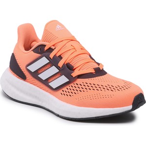 Pomarańczowe buty sportowe Adidas sznurowane w sportowym stylu