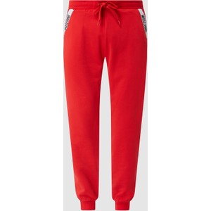 Czerwone spodnie Moschino z bawełny w sportowym stylu