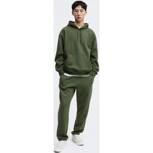 Zielone spodnie H & M w sportowym stylu