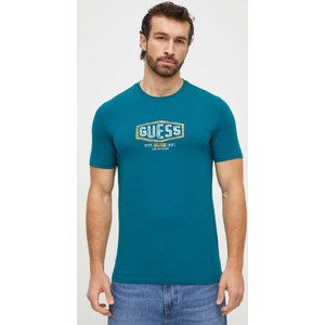 Niebieski t-shirt Guess z bawełny z krótkim rękawem z nadrukiem
