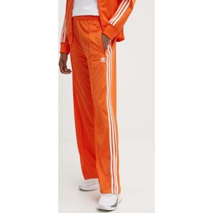 Pomarańczowe spodnie sportowe Adidas Originals z dresówki