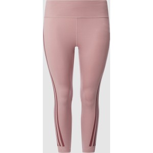 Różowe spodnie Adidas Sportswear Plus w sportowym stylu