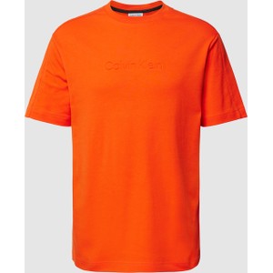 Pomarańczowy t-shirt Calvin Klein w stylu casual