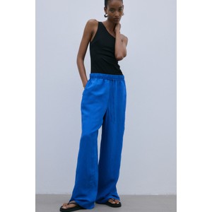 Niebieskie spodnie H & M z tkaniny w stylu retro