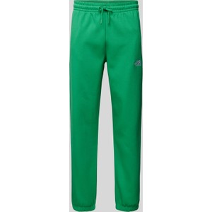 Zielone spodnie The North Face z bawełny