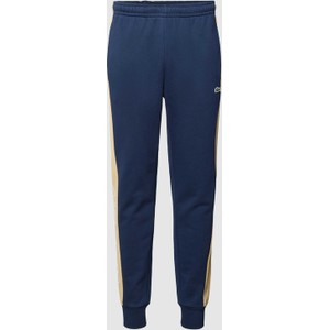 Niebieskie spodnie Lacoste w sportowym stylu