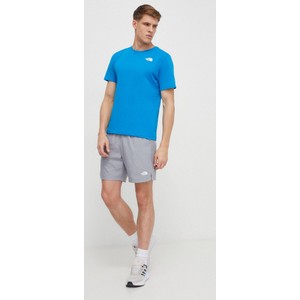 Niebieski t-shirt The North Face z krótkim rękawem w sportowym stylu z nadrukiem