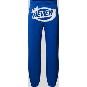 Niebieskie spodnie Review w sportowym stylu z nadrukiem
